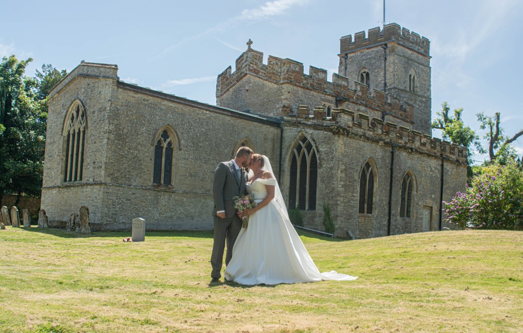 Female wedding photographer , Bride and Groom , Church , Wedding Dress